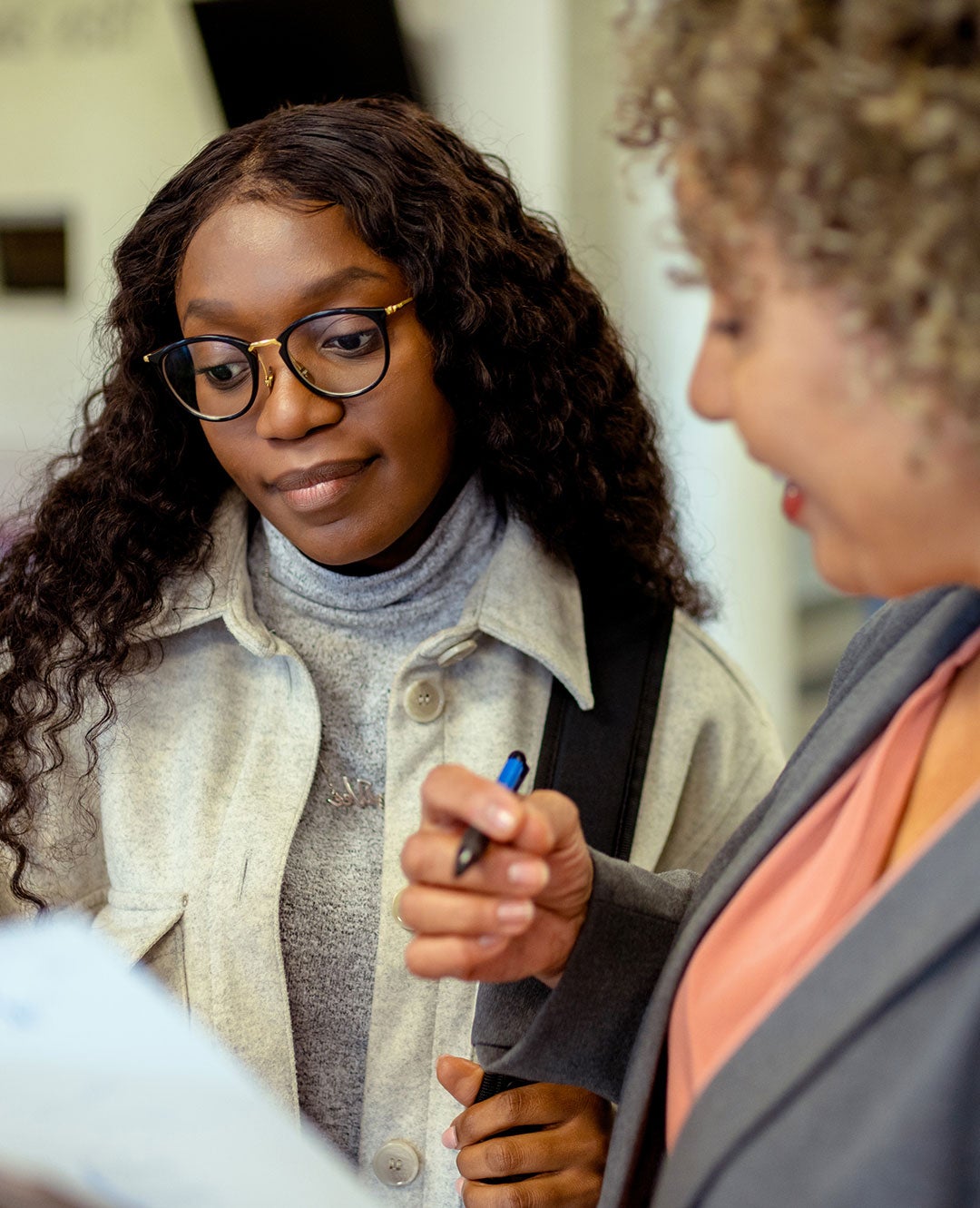Image of a student talking with their instructor